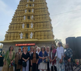 group of people outside huge building